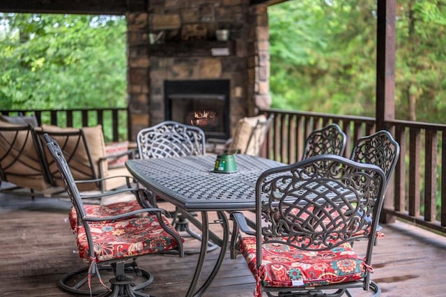 wooden terrace with exterior fireplace