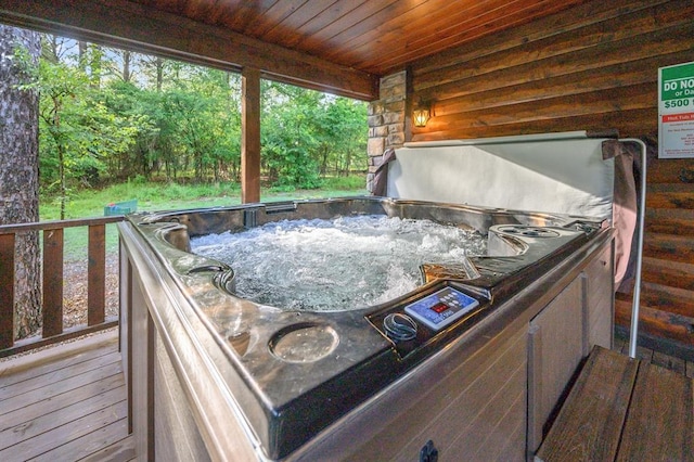 deck with a hot tub