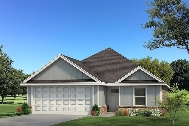 view of front of house featuring a garage and a front yard