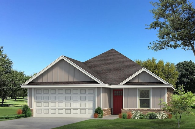 view of front of house featuring a front yard and a garage