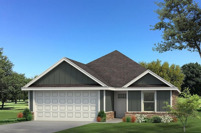 view of front of home with a garage and a front lawn