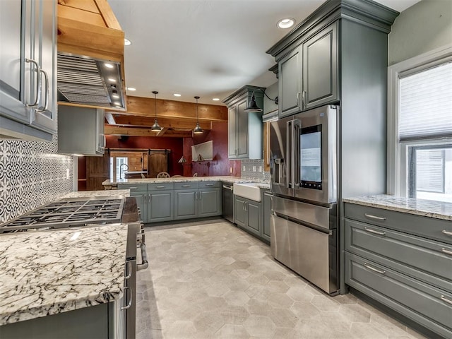 kitchen with gray cabinetry, sink, appliances with stainless steel finishes, tasteful backsplash, and decorative light fixtures