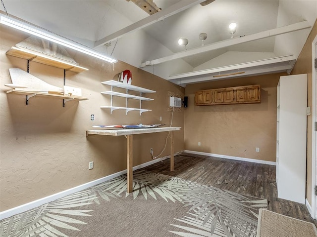 interior space featuring a wall mounted AC and dark hardwood / wood-style floors