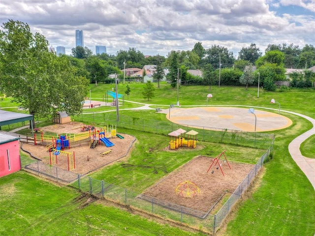 view of community featuring a lawn and a playground