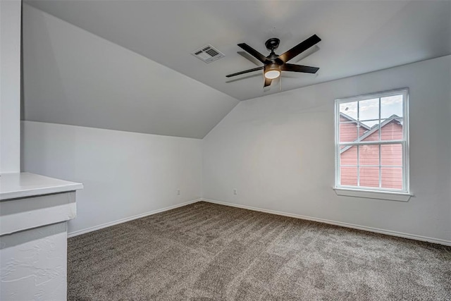 additional living space with ceiling fan, carpet floors, and vaulted ceiling