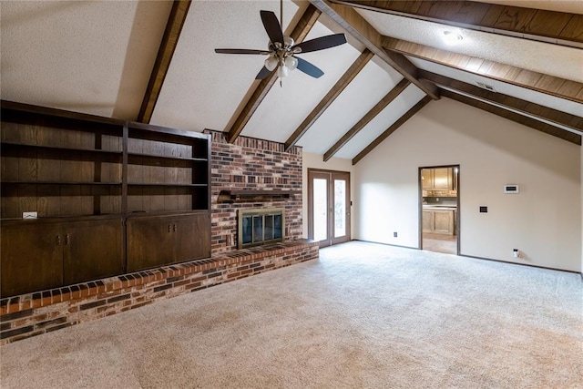 unfurnished living room with ceiling fan, french doors, carpet, and lofted ceiling with beams