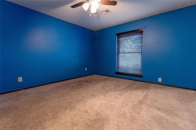 carpeted empty room with ceiling fan