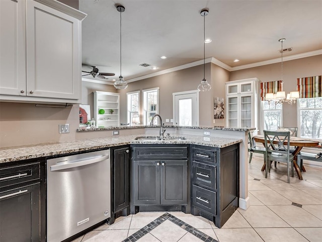 kitchen with white cabinetry, dishwasher, a healthy amount of sunlight, and ceiling fan with notable chandelier