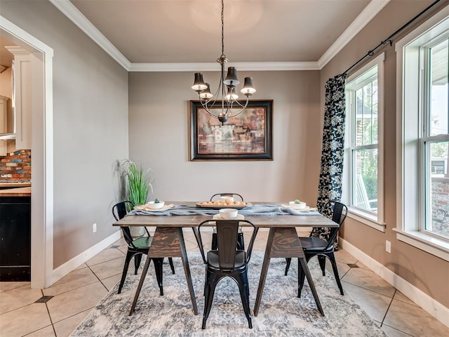 dining area with a chandelier, light tile patterned floors, and crown molding