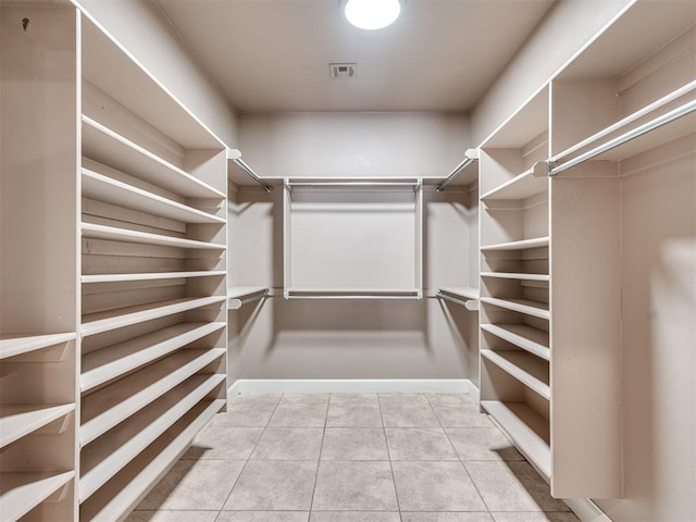 walk in closet featuring light tile patterned floors