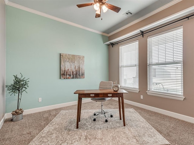 carpeted home office with ceiling fan and ornamental molding