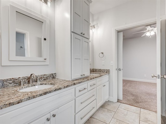 bathroom featuring tile patterned flooring, vanity, and ceiling fan