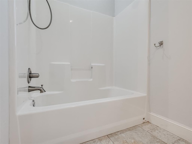 bathroom featuring tile patterned floors and shower / bath combination