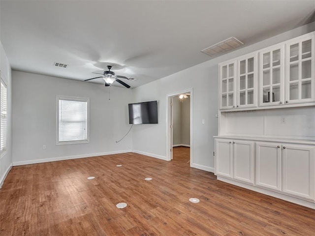 unfurnished room featuring ceiling fan and light wood-type flooring