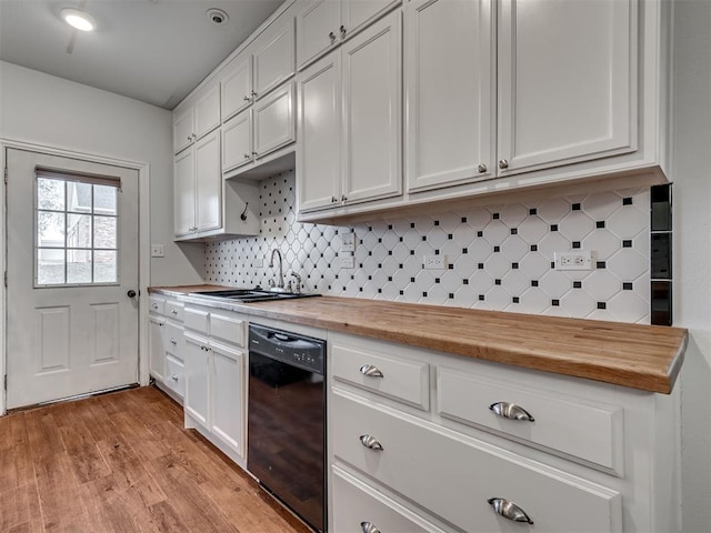 kitchen featuring dishwasher, white cabinets, light hardwood / wood-style flooring, and butcher block counters