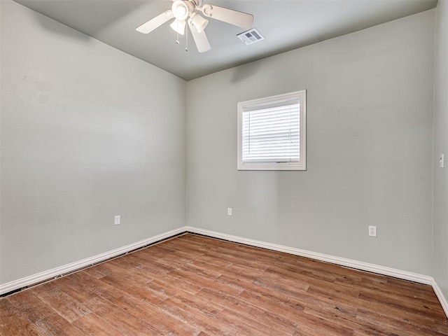 spare room with light hardwood / wood-style floors and ceiling fan