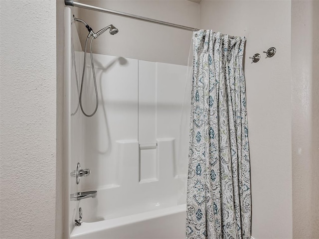 bathroom featuring shower / bathtub combination with curtain