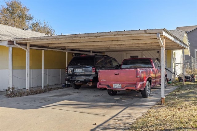 view of vehicle parking with a carport