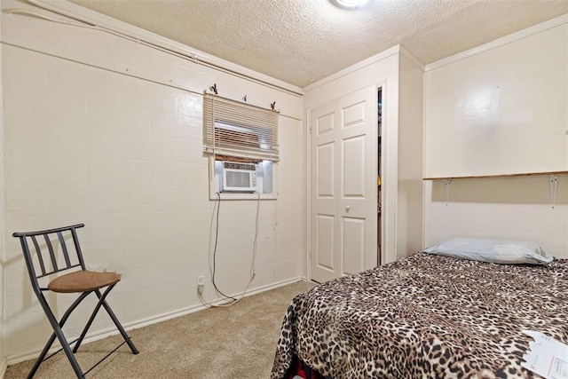 carpeted bedroom with cooling unit, ornamental molding, a closet, and a textured ceiling