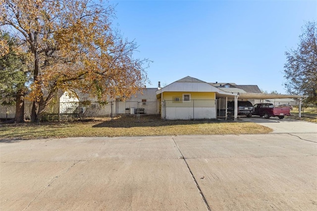 view of front of home with a carport