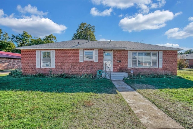 ranch-style house with a front yard