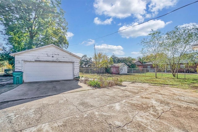 garage featuring a yard