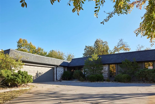 ranch-style home featuring a garage