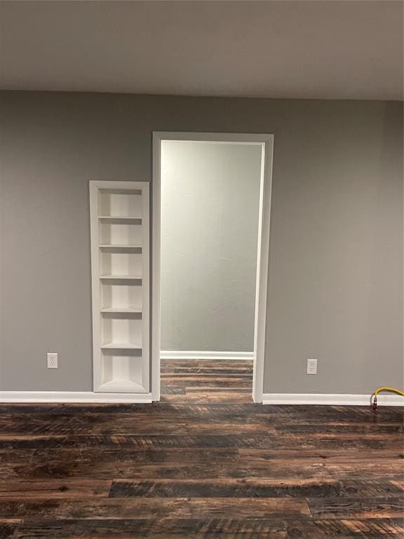 spare room with dark hardwood / wood-style floors