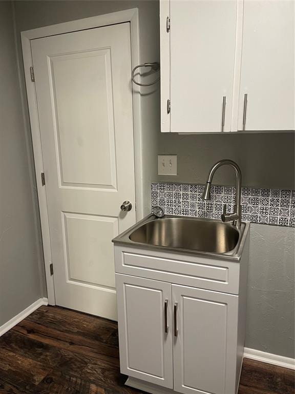 kitchen featuring sink, white cabinets, and dark hardwood / wood-style floors