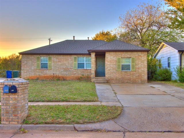 ranch-style house featuring a yard