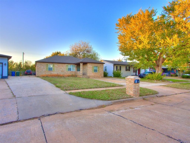 ranch-style house with a front yard