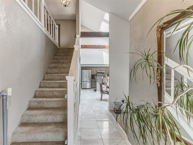 stairway featuring lofted ceiling