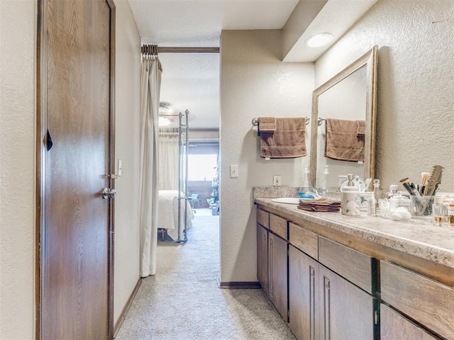 bathroom with vanity and a textured ceiling