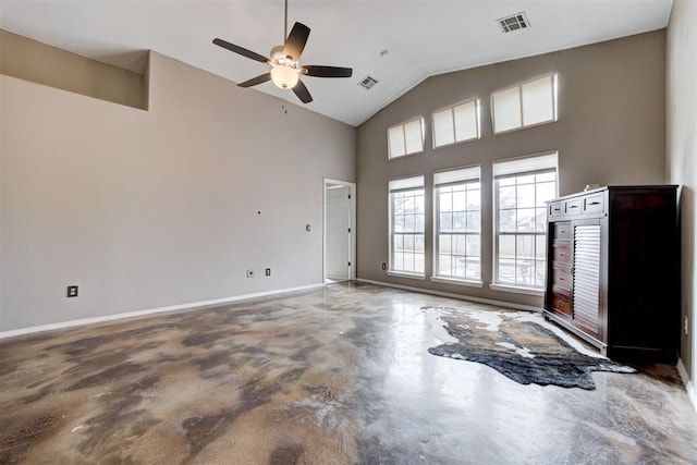 spare room featuring ceiling fan, concrete flooring, and high vaulted ceiling