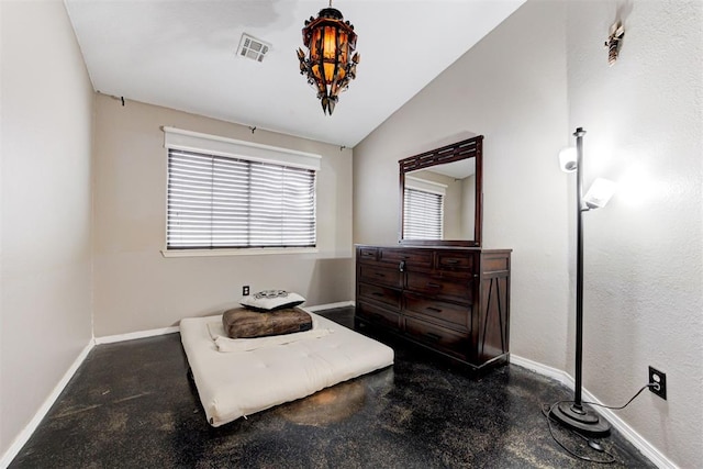 sitting room with lofted ceiling