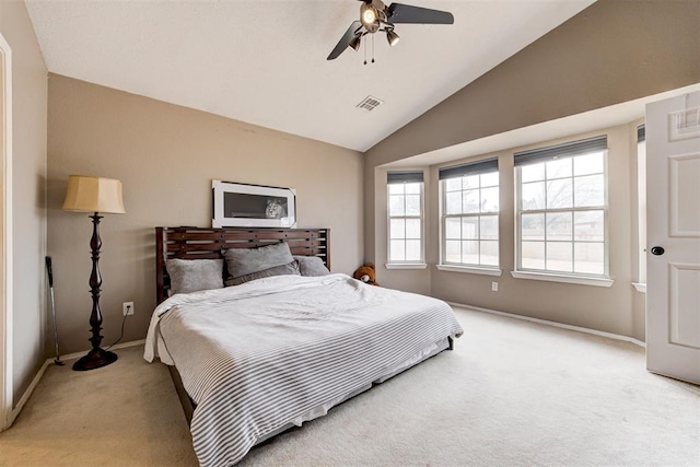 carpeted bedroom featuring lofted ceiling and ceiling fan