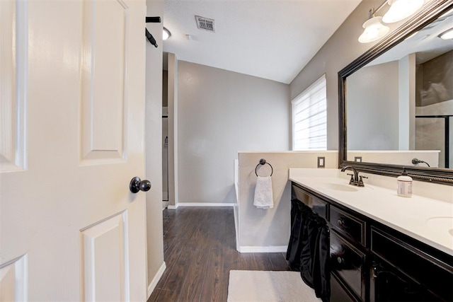 bathroom featuring vanity and hardwood / wood-style floors