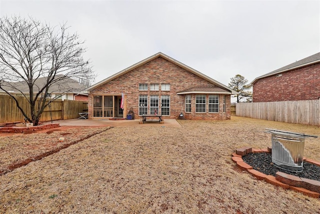 back of property featuring a patio area