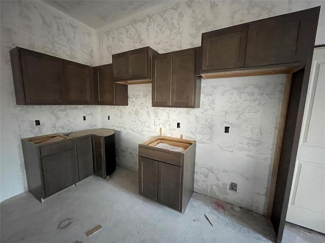 kitchen featuring dark brown cabinetry