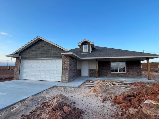 view of front of property with a garage