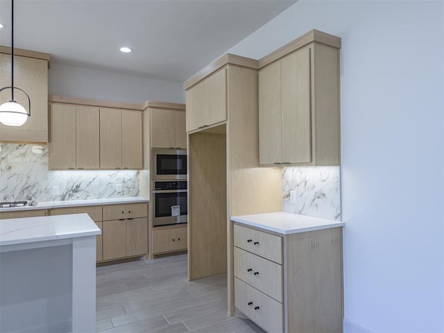 kitchen featuring light brown cabinets, stainless steel appliances, backsplash, light hardwood / wood-style floors, and pendant lighting