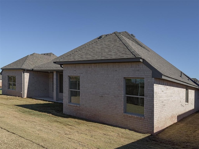 view of home's exterior featuring a lawn