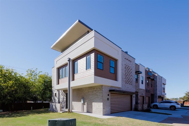 view of property exterior with central air condition unit, a lawn, and a garage