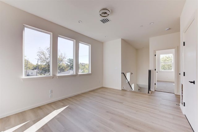 spare room with light wood-type flooring