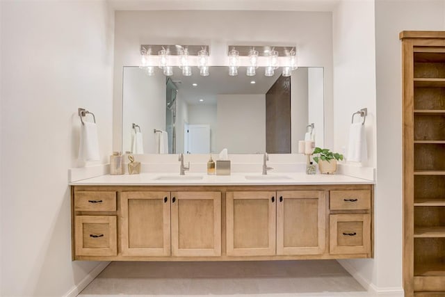 bathroom with tile patterned flooring and vanity