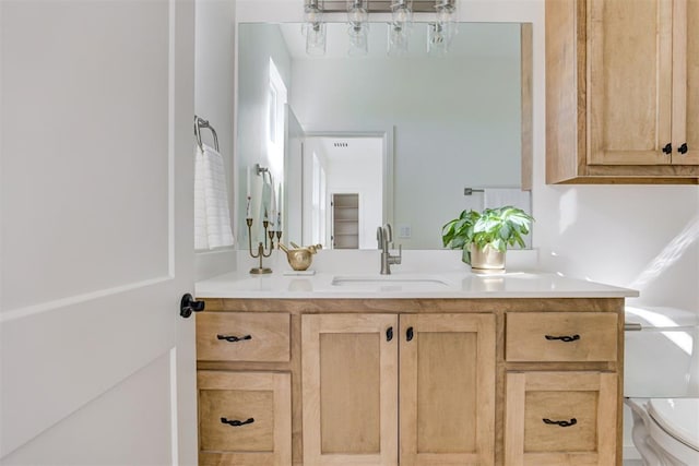 bathroom with vanity and toilet