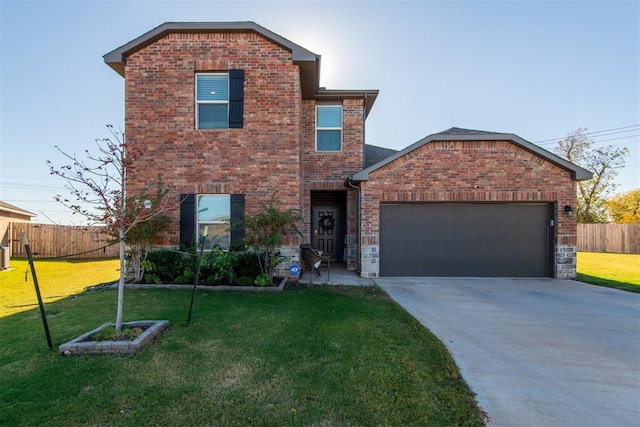 view of front property featuring a garage and a front yard