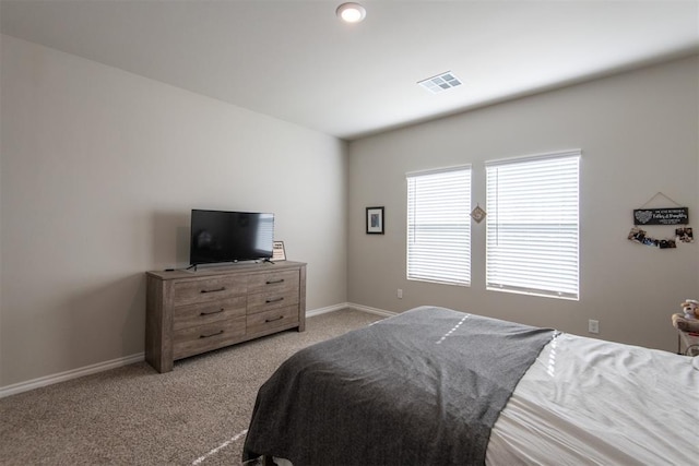 bedroom featuring light carpet