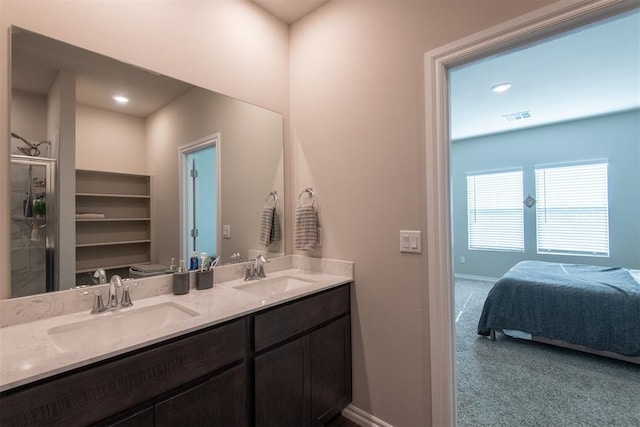 bathroom featuring vanity and a shower with shower door