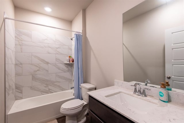 full bathroom with shower / tub combo with curtain, vanity, and toilet